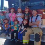 Preschoolers on a firetruck